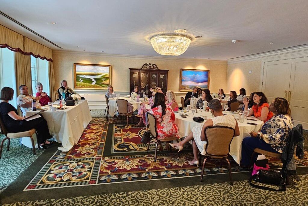 Ali Ingersoll speaking to a group of women's business owners at a NAWBO greater Raleigh luncheon on the topic of preparing for a Ted talk