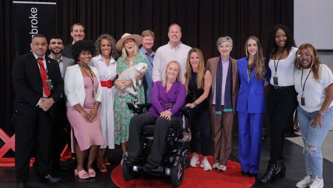 Ali Ingersoll with a group of organizers and speakers after giving her Ted Talk "Turning paralysis into purpose: Using adversity to achieve success"